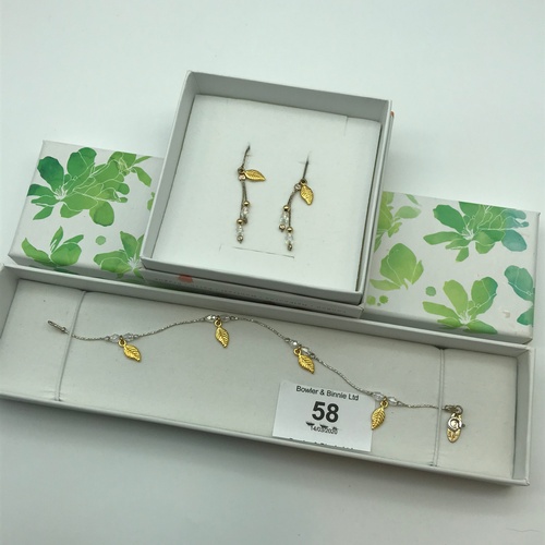 99J - Designer 'Magnolia' silver and 14ct gold bracelet and matching earrings. Both come with original box... 