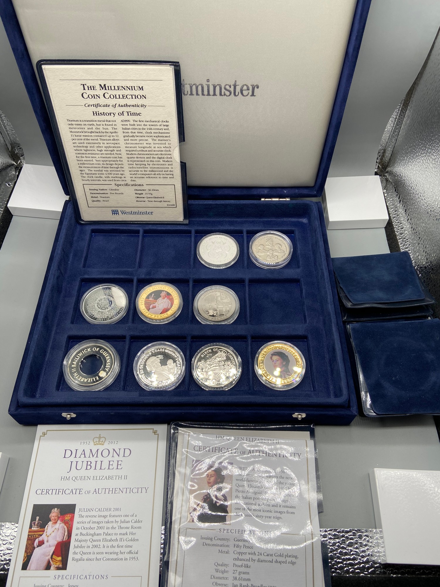 A Westminster Mint 'The Millennium' coin collection [4 coins] with a ...