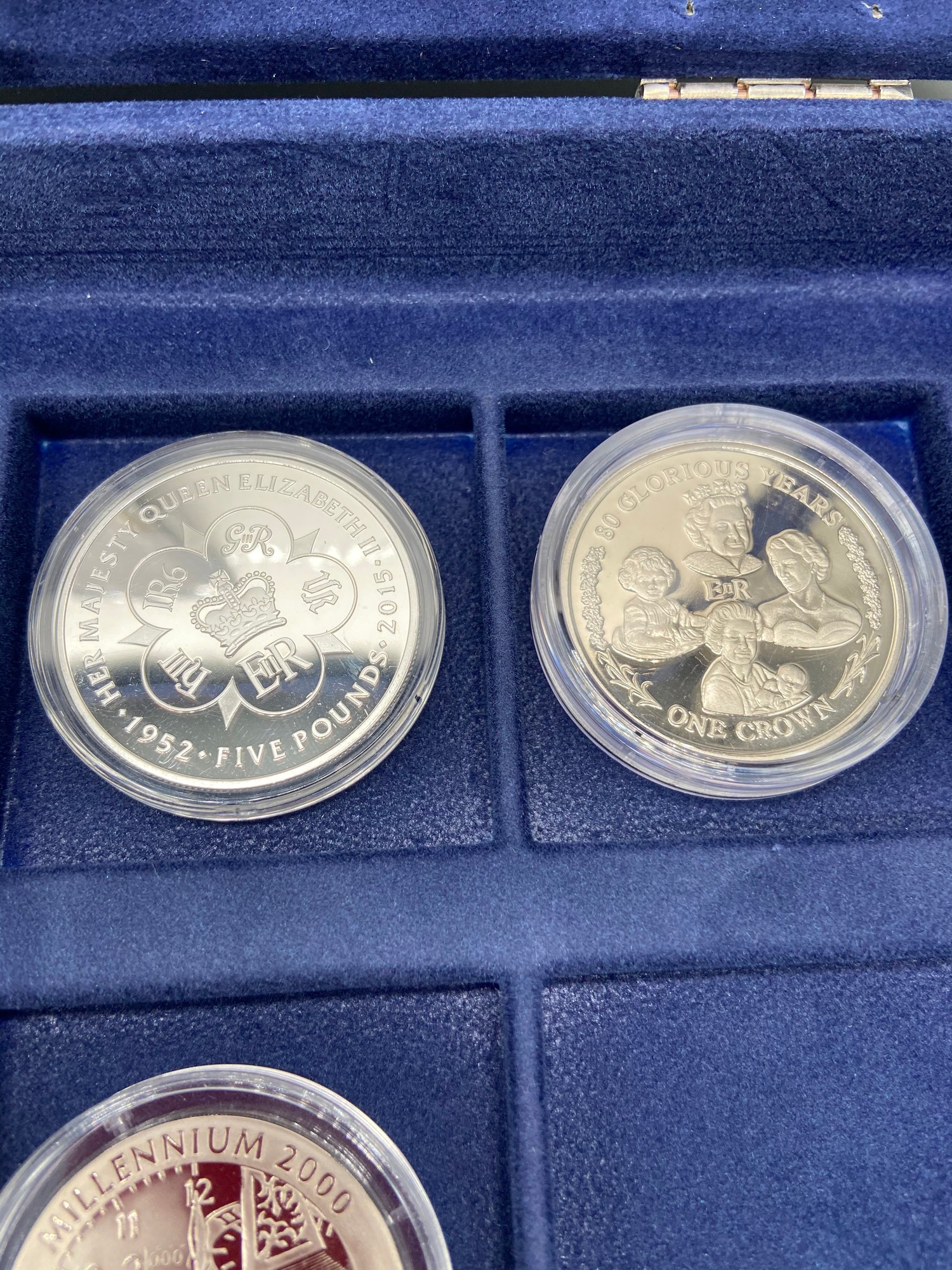 A Westminster Mint 'The Millennium' coin collection [4 coins] with a