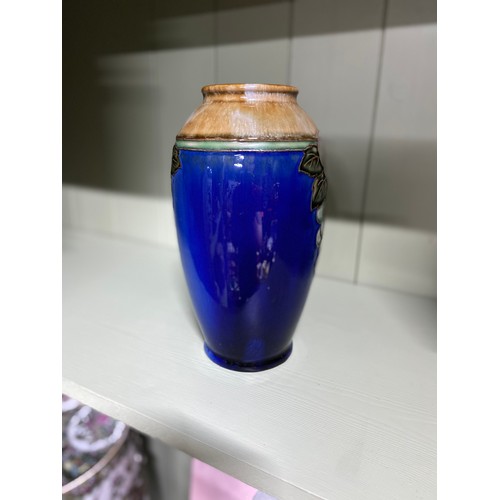 202 - A Royal Doulton stoneware plum design vase. Signed JH To the base. [