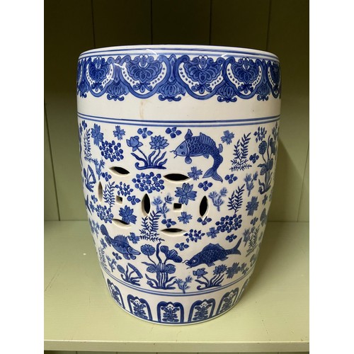 188 - A 20th century Chinese blue and white koi carp and floral design porcelain stool. [
