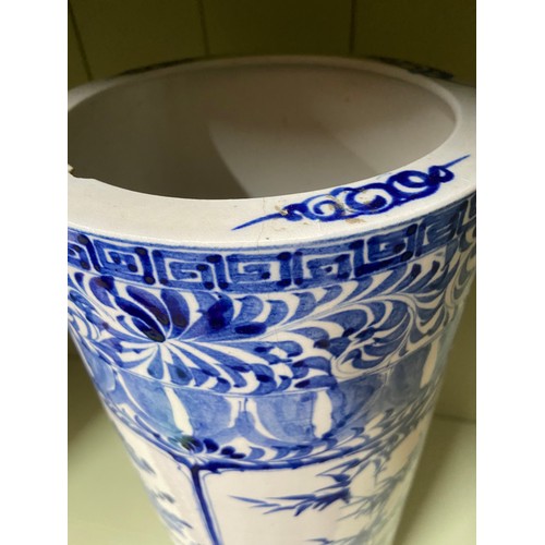 186 - A 20th century Chinese blue and white paint brush pot/ stick stand. [A/F]