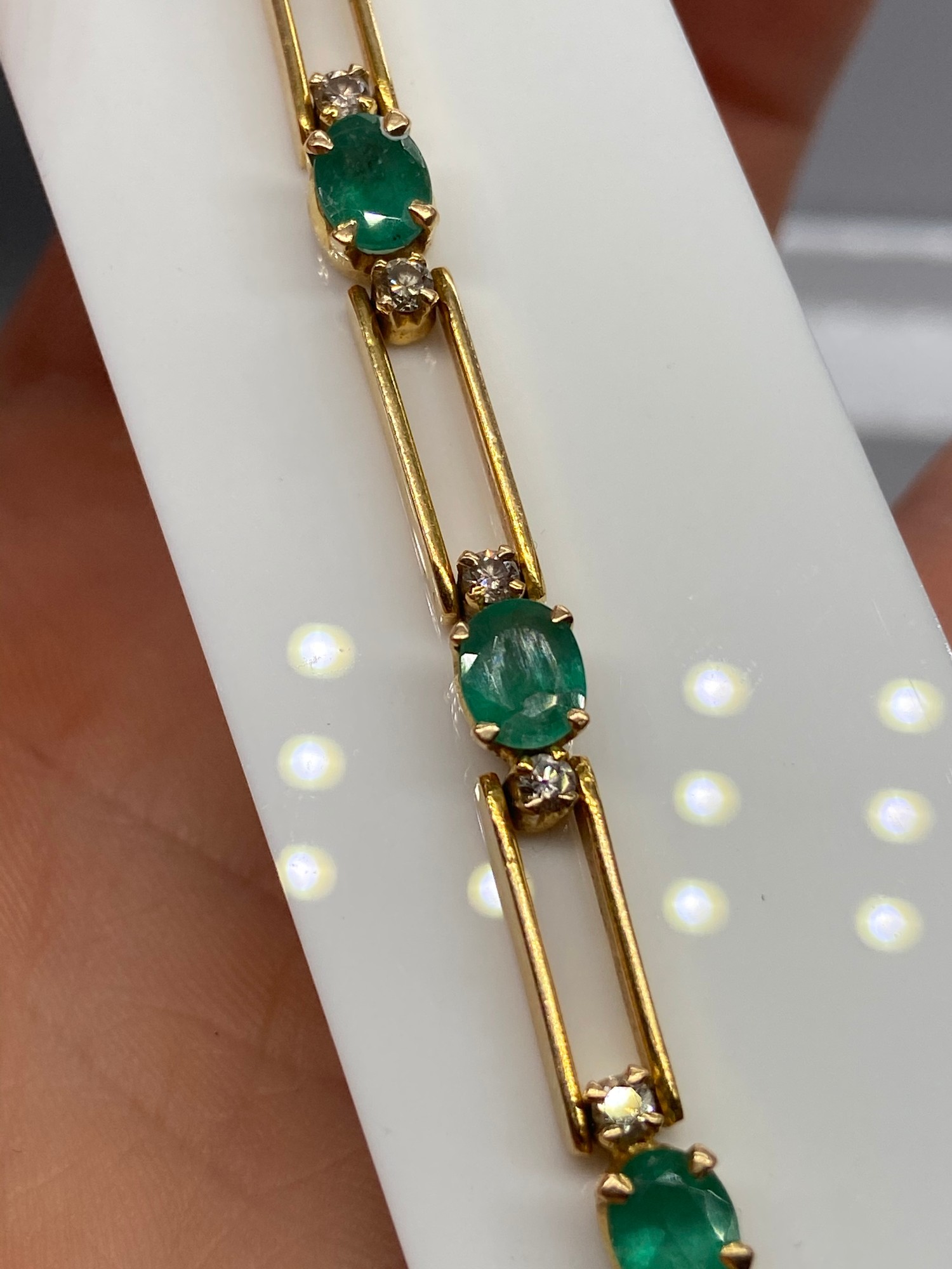 A Ladies 18k gold Diamond and Emerald bracelet. 0.64ct in total. [17