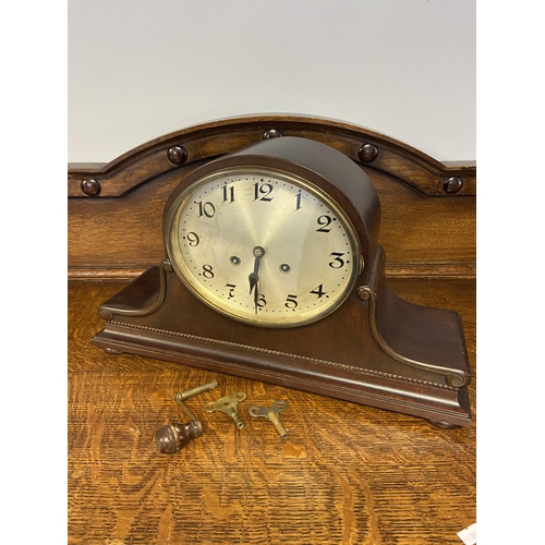 19A - A antique junghans mantle clock comes with key and pendulum in working condition