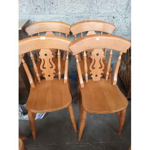 1 - 6 Pine farmhouse chairs with decorative backs includes carvers