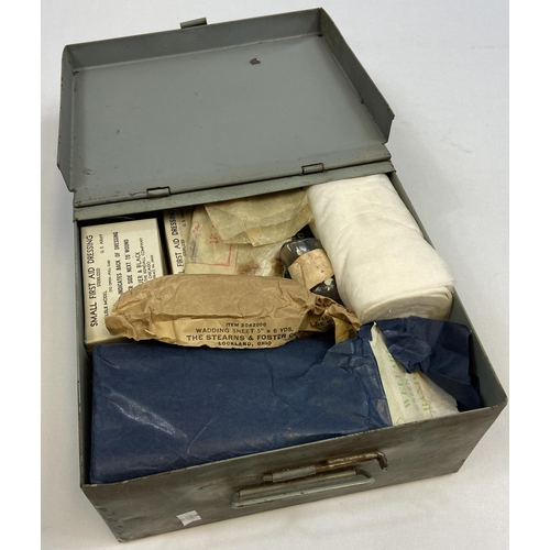 217 - A WW2 First aid box containing contents.