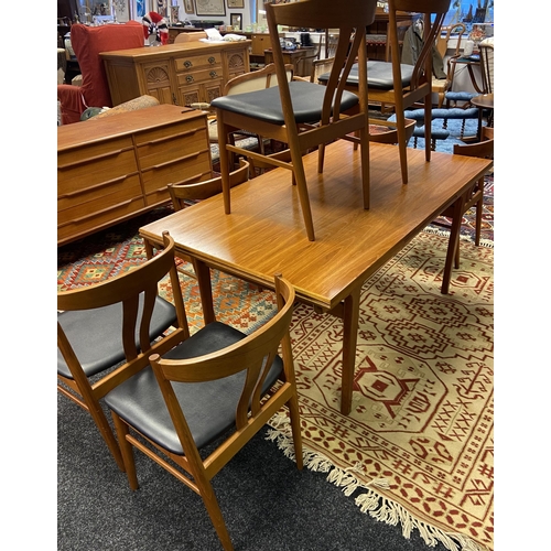 330 - A Danish teak mid century extendable dining table together with 8 matching stylish teak chairs by Ve... 