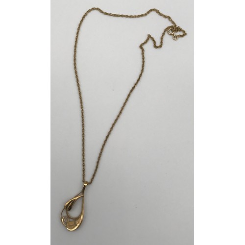 14 - A Ladies 9ct gold floral design pendant with a 9ct gold necklace. [7.97grams]