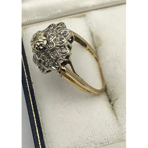 9 - A Ladies 9ct yellow gold and diamond cluster ring. [.25ct] [Ring size N] [3.22Grams]