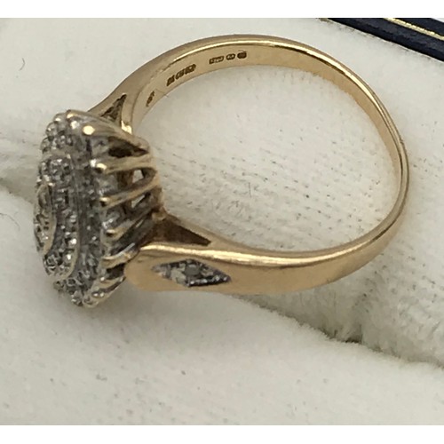 6 - A ladies 9ct yellow gold diamond cluster ring [.15ct][Ring size] [3.18grams]