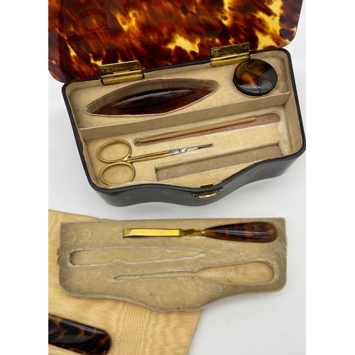23 - Antique tortoise shell manicure set with silver hinge