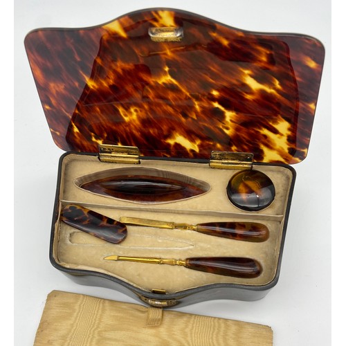 23 - Antique tortoise shell manicure set with silver hinge