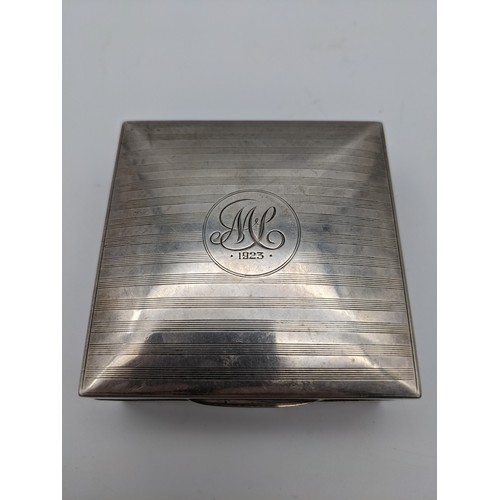 40 - A Birmingham silver cigarette box. [9cmx8.5cm]