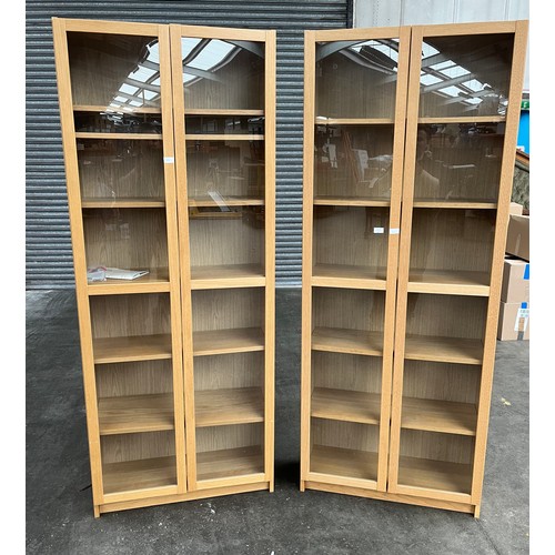 31 - A Pair of Billy Ikea bookcases with double glass doors.