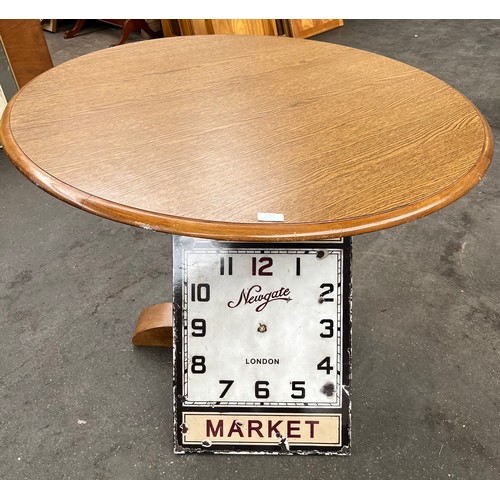 46 - Round dining table and Modern clock face.