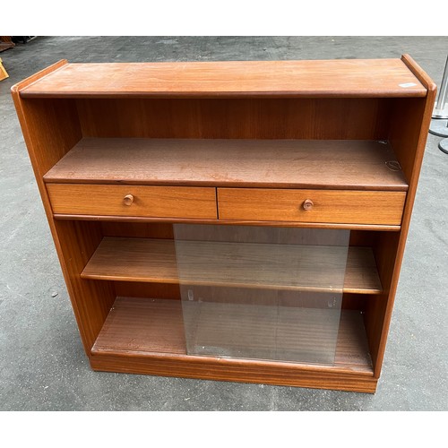 43 - A Nathan teak bookcase with glass sliding doors.