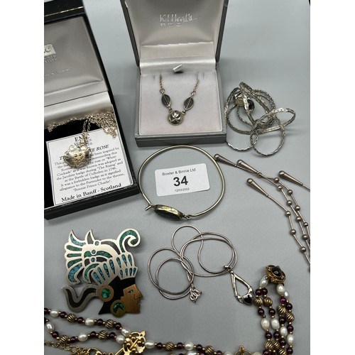 34 - A Quantity of silver jewellery to include necklaces, earrings, bangles, and pearl necklaces.