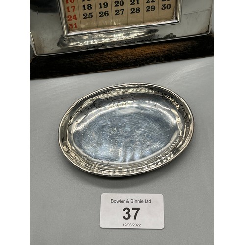 37 - A Birmingham silver front desk Calendar. Together with a Birmingham silver dish. [calendar- 10x14.5x... 