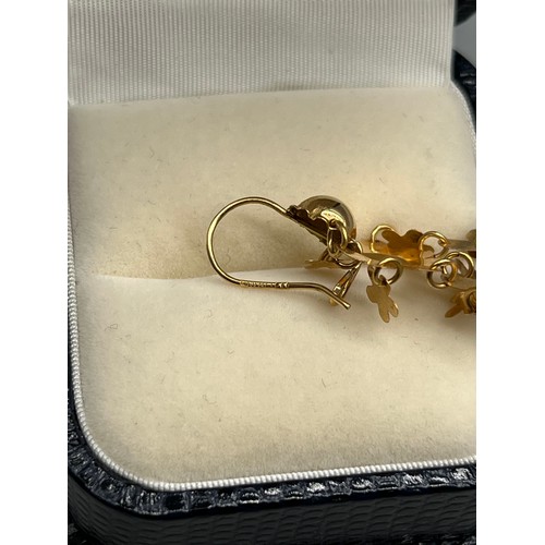 15 - A Pair of 18ct yellow gold earrings. [3.35grams]