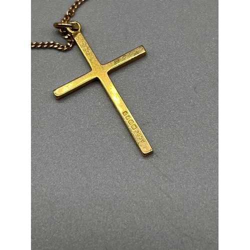 12 - 18ct yellow gold cross pendant with a 9ct yellow gold chain. [4.58grams] [48cm in length]