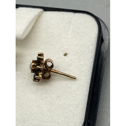 7 - A Pair of 9ct gold sapphire and pearl earrings.