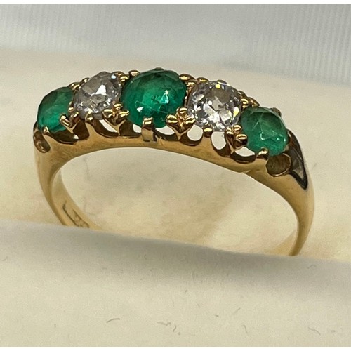 5 - A Yellow Gold ladies Emerald and diamond ring. [Ring size N] [Centre emerald- 5x3.5mm] [Diamonds- 3.... 