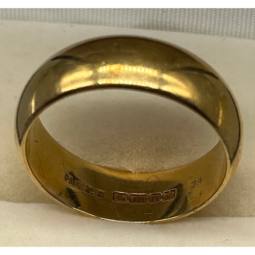 4 - An 18ct gold wedding band. [Ring size Q 1/2] [8.33Grams]