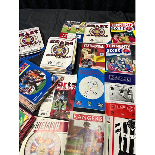 12 - A Large collection of vintage football programmes to include Hearts, Rangers and Pars. One Signed.