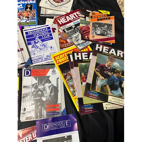 12 - A Large collection of vintage football programmes to include Hearts, Rangers and Pars. One Signed.