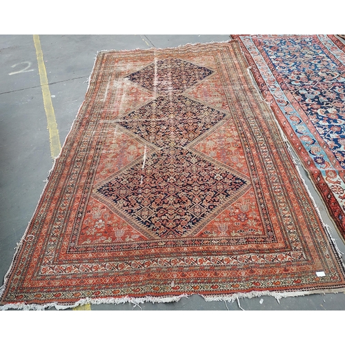 18 - A Large Antique Indian rug. [Wear in areas][292x169cm]