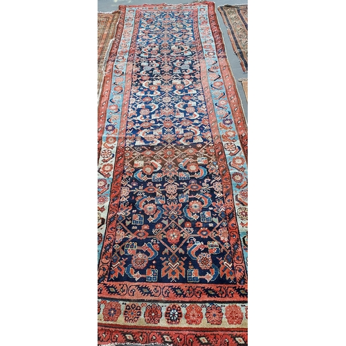 19 - A Large Antique Indian style runner rug. [368x144cm]