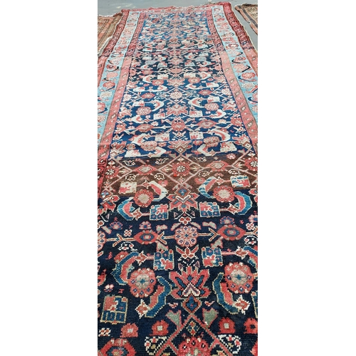 19 - A Large Antique Indian style runner rug. [368x144cm]
