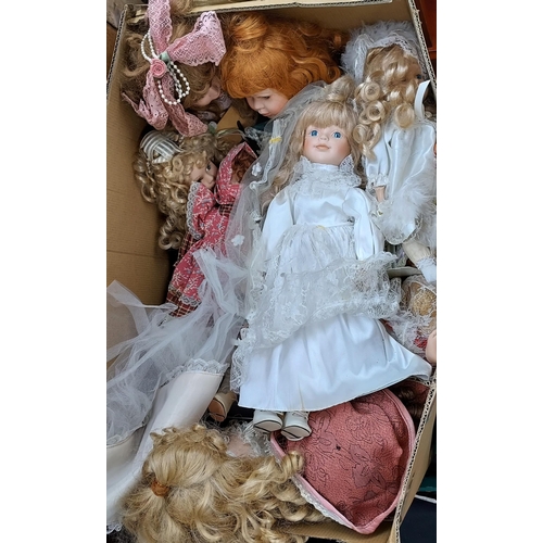 22 - Two boxes of mixed porcelain dolls.
