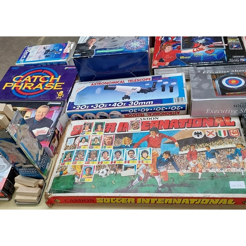 29 - A Collection of vintage games and toys to include Casdons soccer international, lego, telescope, gla... 