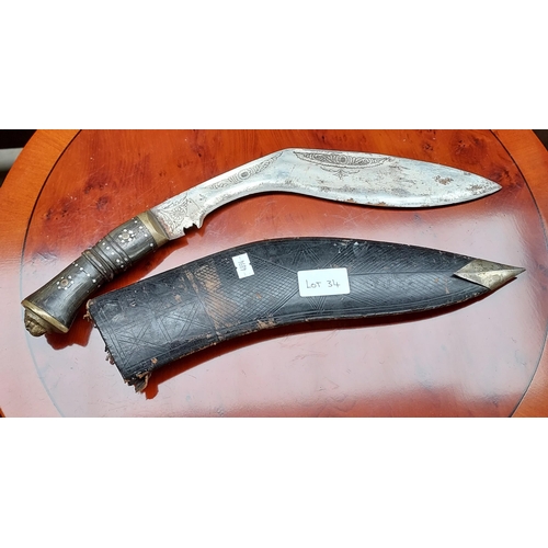 34 - A Vintage Kukri knife and scabbard