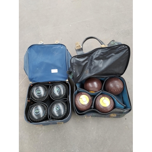 41 - Two bags of bowling green bowls. Includes Taylor set.