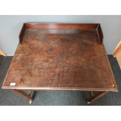38 - 19th century desk, the gallery top, above a rectangular top and two frieze drawers, raised on square... 