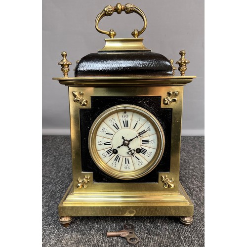 376 - Antique Heavy brass and black cased mantel clock, comes with key and pendulum. Working  [35x21x12.5c... 
