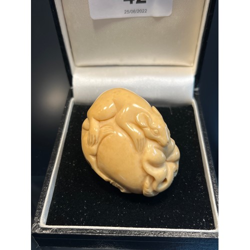 42 - A Japanese hand carved tagua nut netsuke in the form of two rats on a piece of fruit. [4.5cm in leng... 