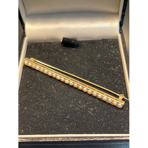 36 - A 14K yellow gold and seed pearl bar brooch [4.12grams] [6.3cm in length]