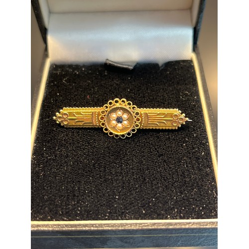37 - Antique 15ct yellow gold bar brooch set with a single sapphire surrounded by seed pearls. [3.14grams... 