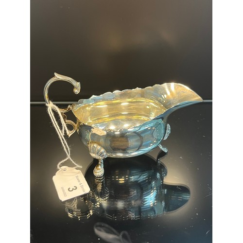 3 - A London silver three foot milk jug. Produced by Edward Barnard & Sons Ltd [93.17grams]