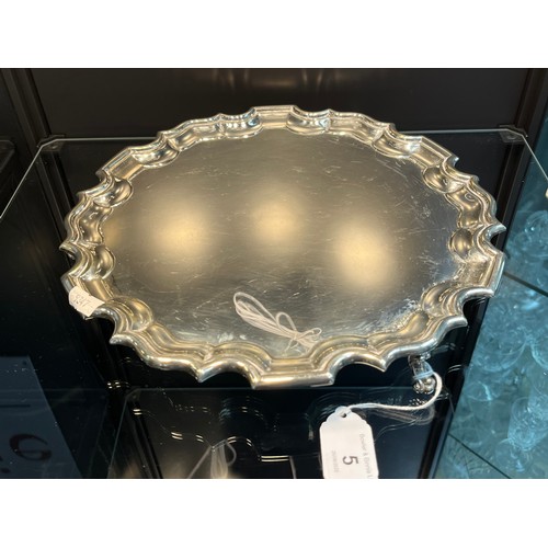 5 - A Sheffield silver three foot serving tray, designed with a pie crust edge. Produced by Stevenson & ... 