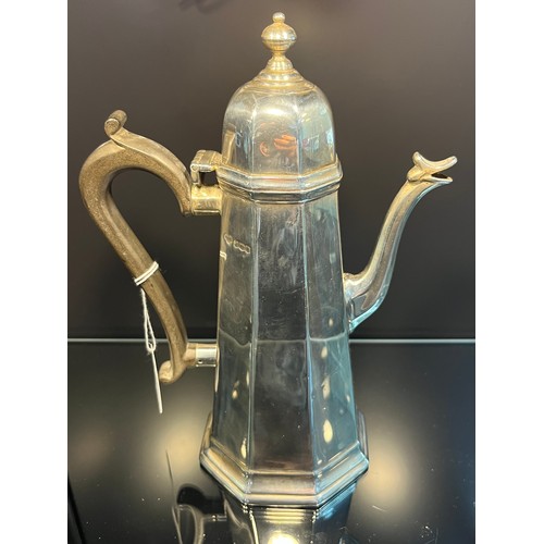 18 - A Sheffield silver coffee pot. [465grams] [22cm high]