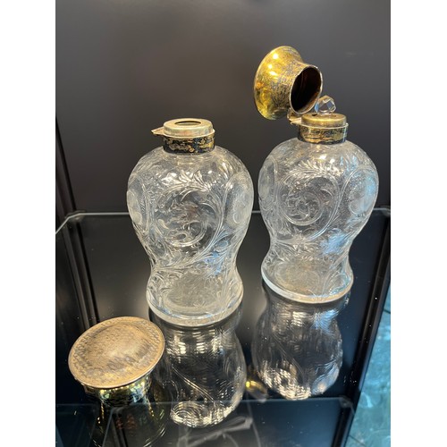 19 - A Pair of London silver gilt topped and cut crystal perfume bottles. [16.5cm high] [One As Found]