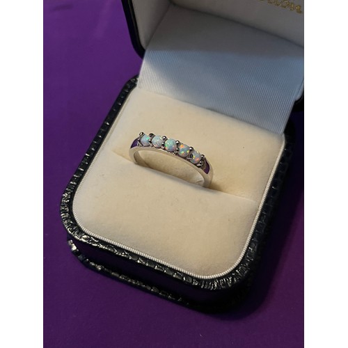 36j - A Silver and opal 5 stone opal ring.