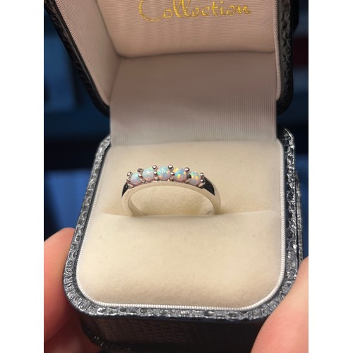 36j - A Silver and opal 5 stone opal ring.