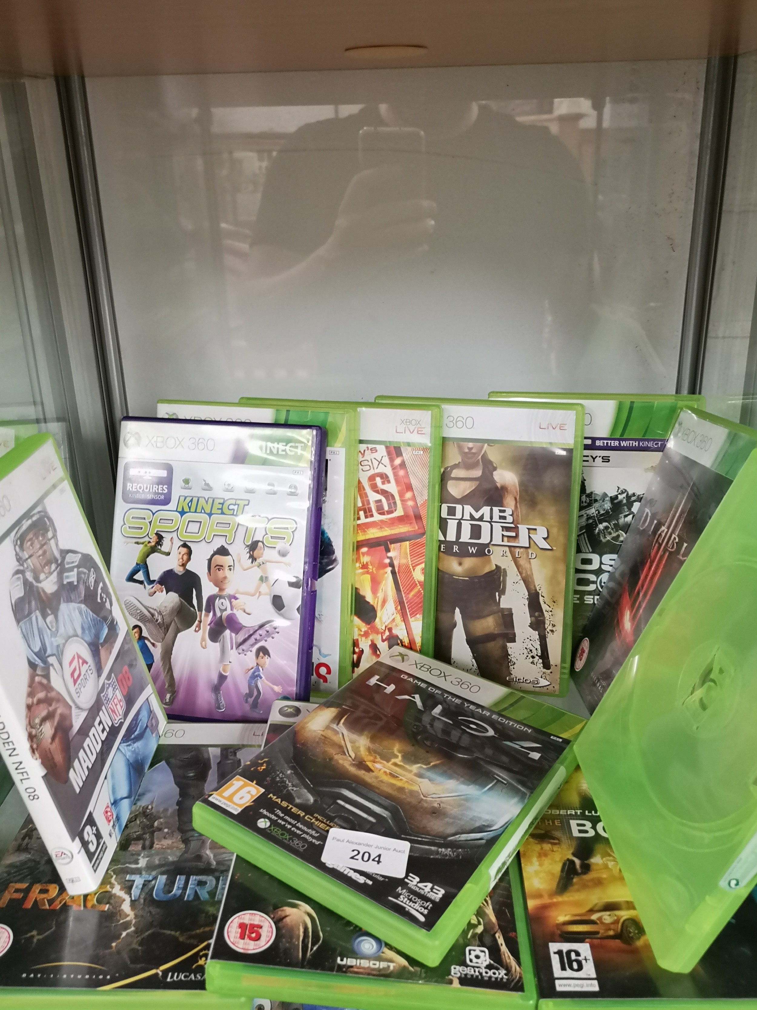 Shelf of xbox 360 games.
