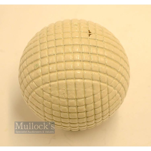 27 - Fine and original and unused moulded mesh large guttie golf ball - with all the original white paint... 