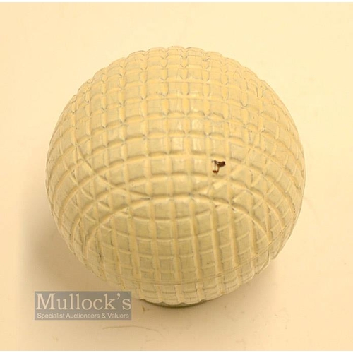 28 - Fine and original and unused moulded mesh small guttie golf ball - with all the original white paint... 